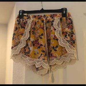 Flowy yellow floral shorts.
